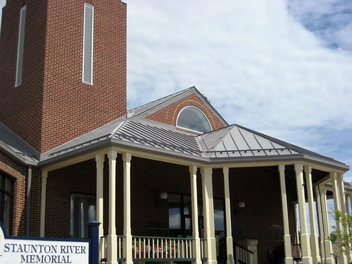 Skilled roofing craftsmen working on a residential roof in Raleigh